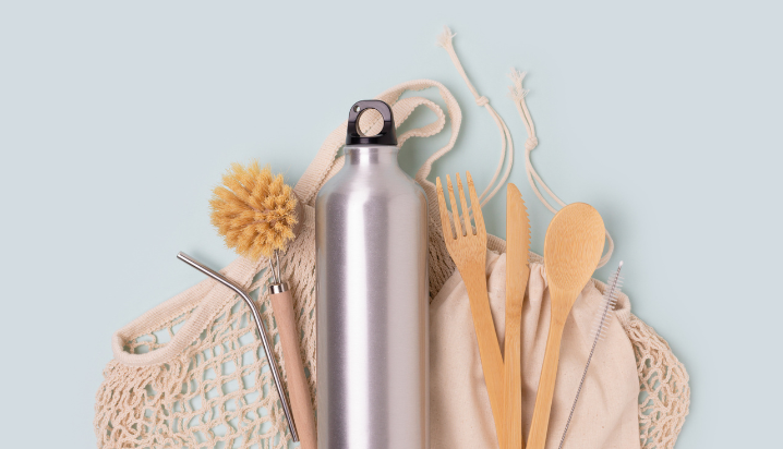 Reusable items like stainless steel water bottle, reusable cutler, and canvas bag.